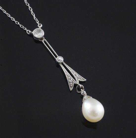 A 1920s platinum, diamond and cultured pearl drop pendant on a platinum fine link chain, pendant 4cm.